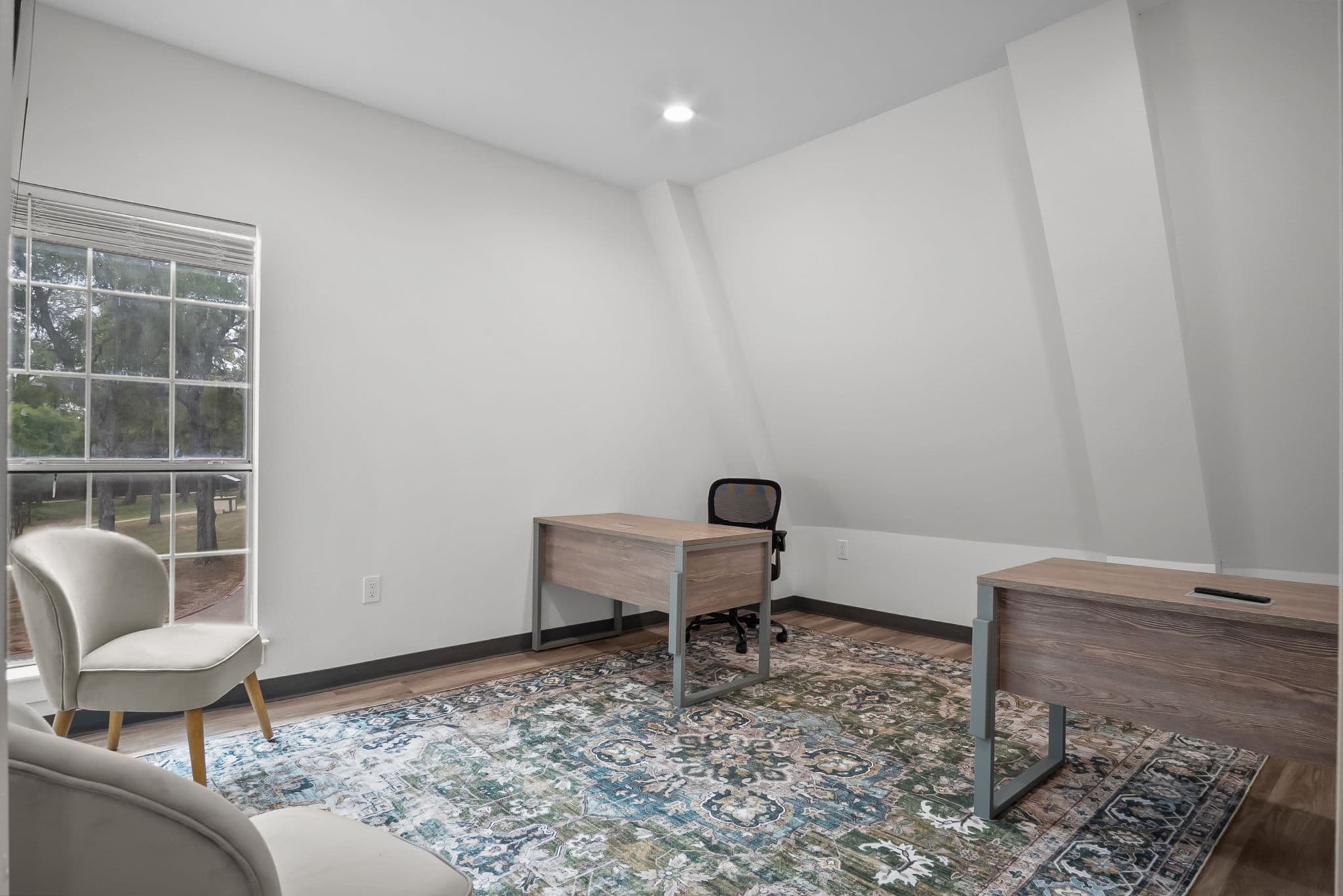 Bedroom with a study area and rug