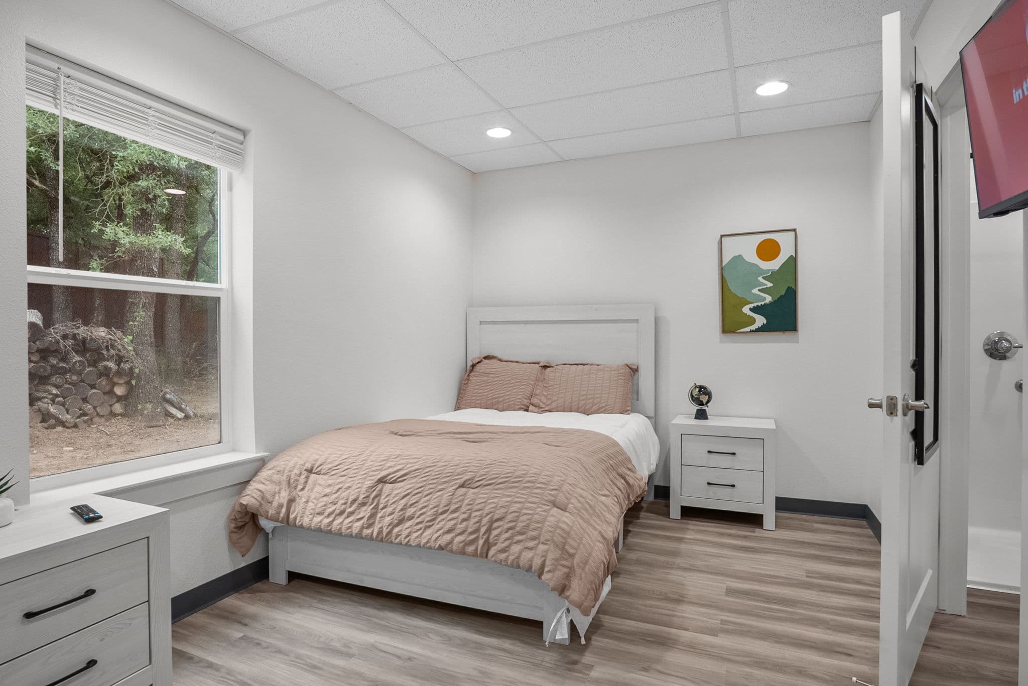 Semi-private bedroom with two beds and storage