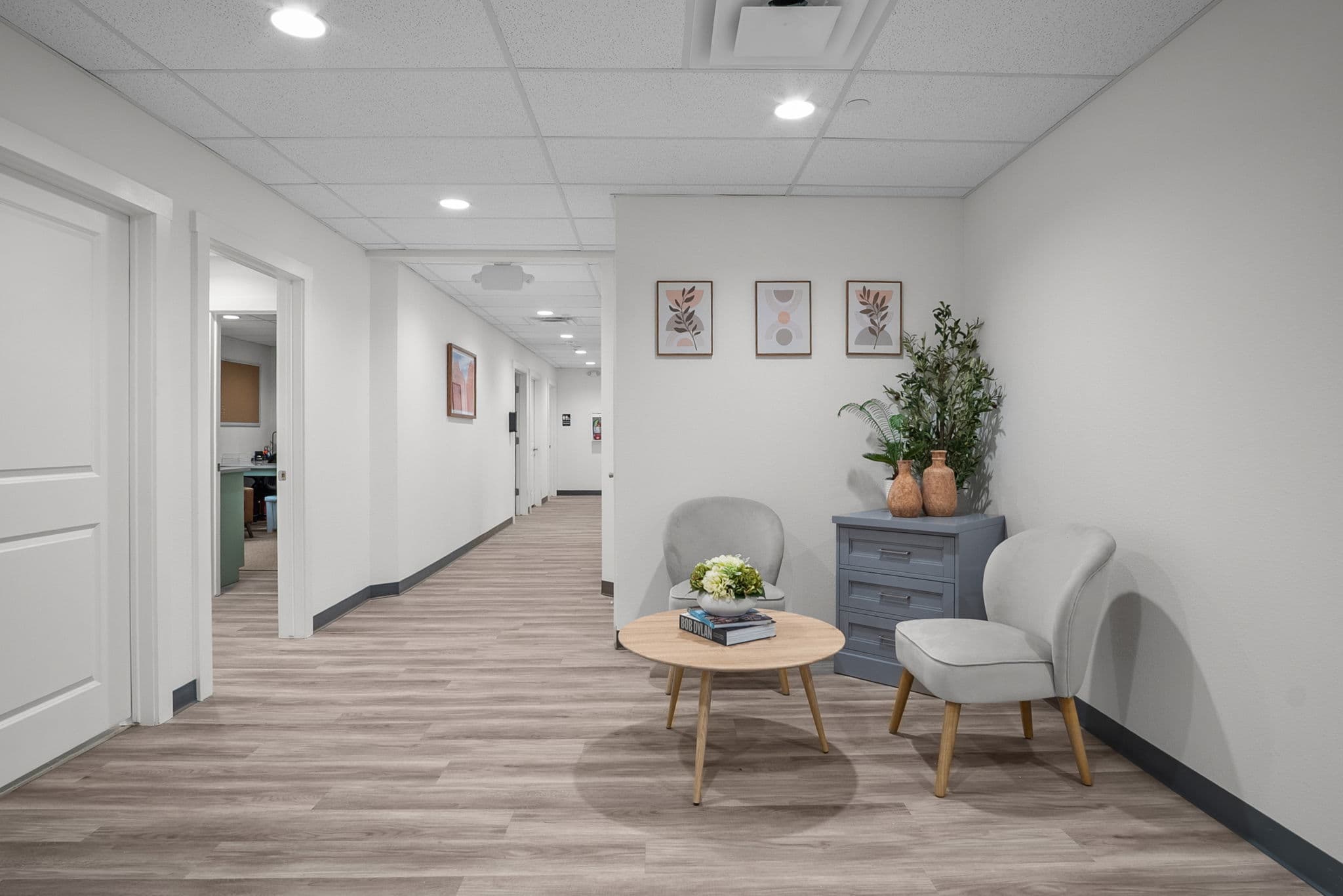 Bright corridor with a small seating nook