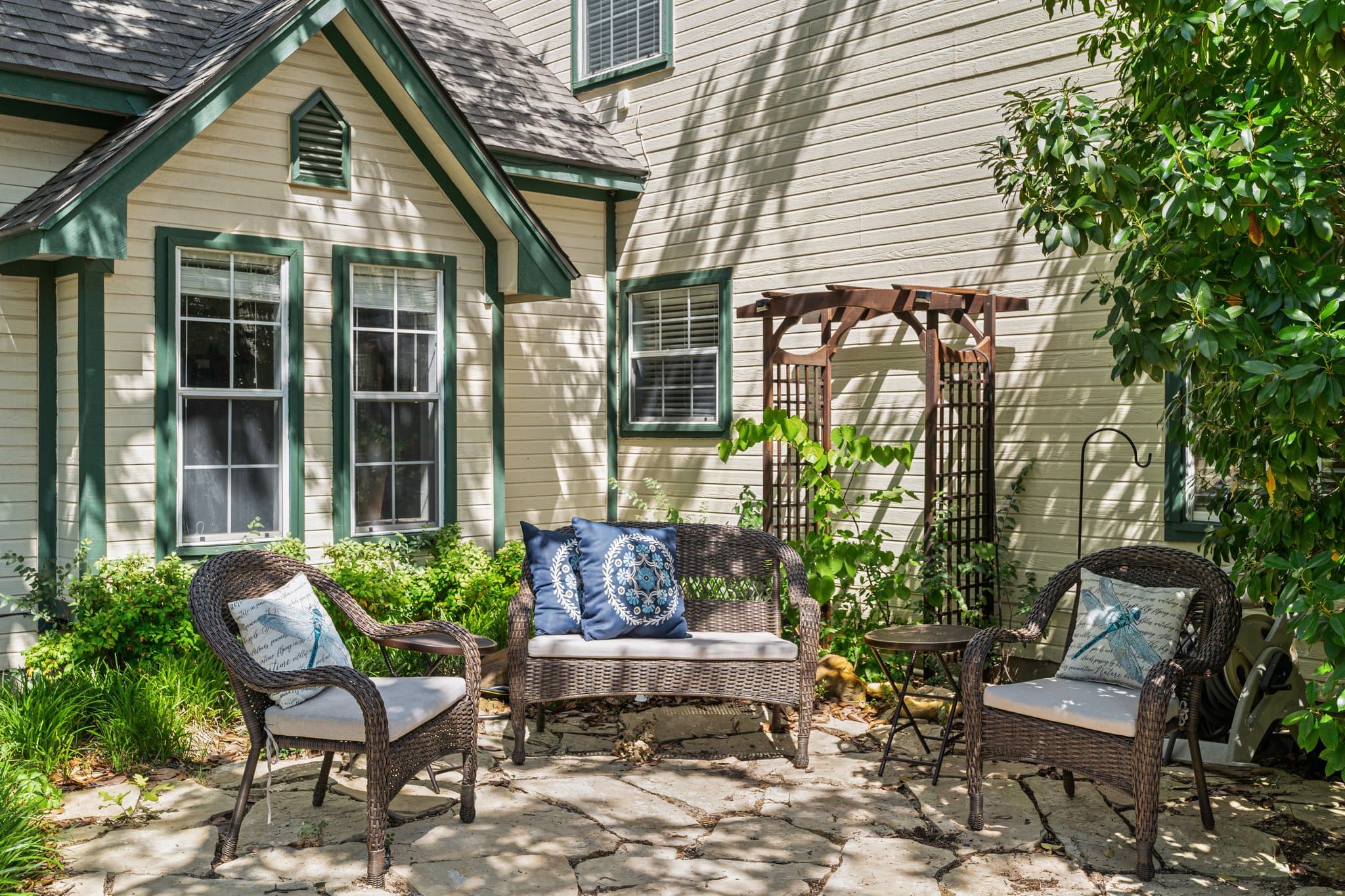 Shaded patio seating beneath a pergola
